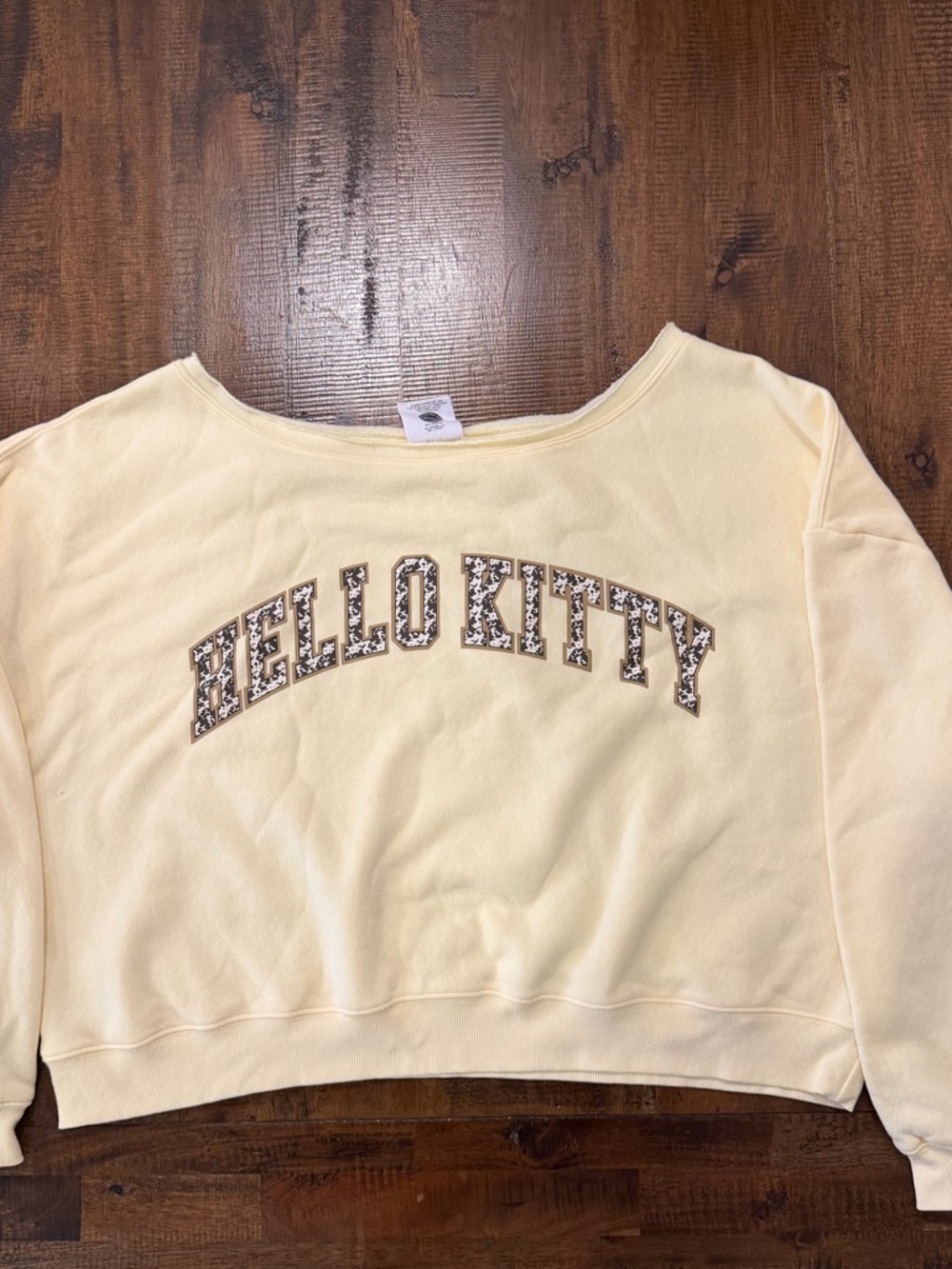 Hello Kitty Pale Yellow Off Shoulder Pullover with Cow Print Logo